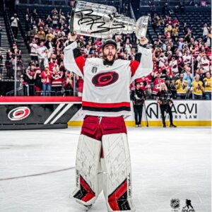 Brandon Bussi Carolina Hurricanes Unsigned 2026 Stanley Cup Champions Raising Cup Photograph