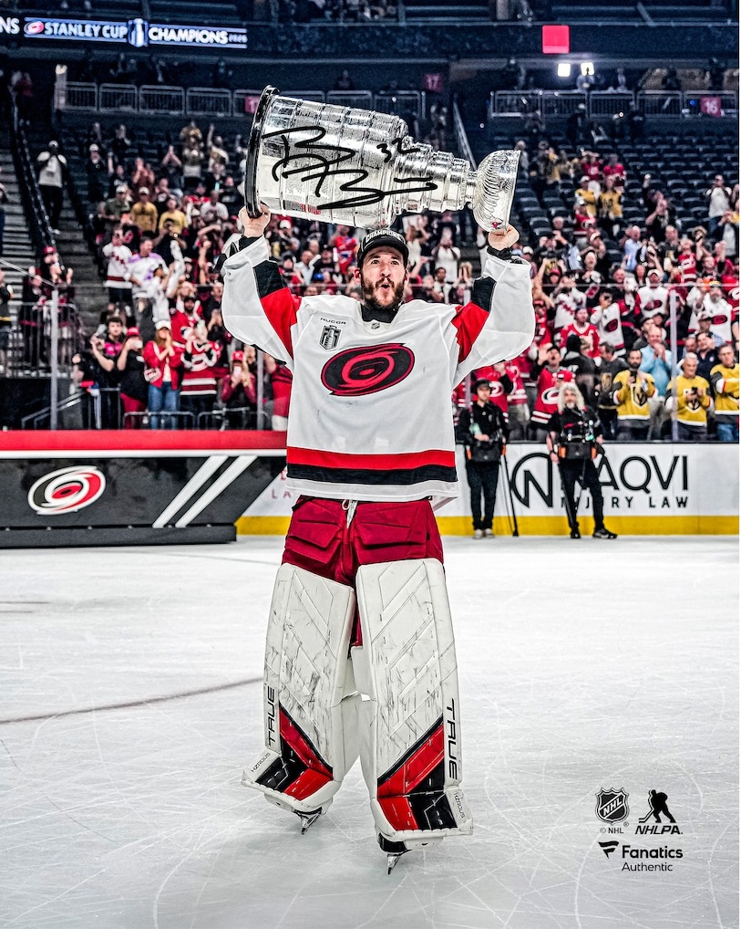 Brandon Bussi Carolina Hurricanes Unsigned 2026 Stanley Cup Champions Raising Cup Photograph