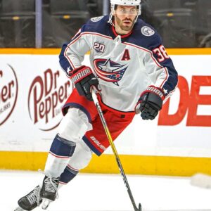 Boone Jenner Columbus Blue Jackets Unsigned White Jersey Skating with Puck vs. Nashville Predators Photograph