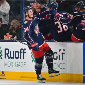 Cole Sillinger Columbus Blue Jackets Unsigned High-Fives Teammates After Scoring First Career NHL Goal Photograph