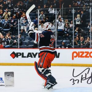 Connor Hellebuyck Winnipeg Jets Autographed 16" x 20" Navy Alternate Jersey Celebration Photograph