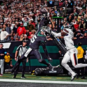 Garrett Wilson New York Jets Unsigned Leaping Touchdown Catch Photograph