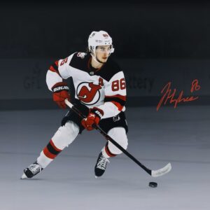 Jack Hughes New Jersey Devils Autographed 16" x 20" White Jersey Skating Spotlight Photograph