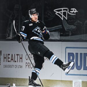 JJ Peterka Utah Mammoth Autographed 16" x 20" Black Jersey Celebration Spotlight Photograph