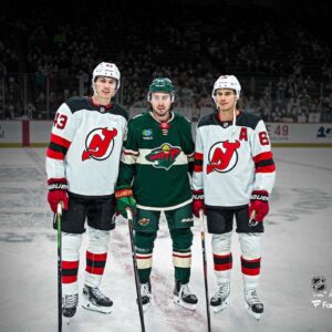 Luke Hughes, Quinn Hughes & Jack Hughes Unsigned On-Ice Pose Photograph