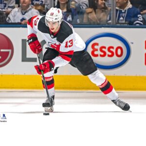 Nico Hischier New Jersey Devils Unsigned White Jersey Skating Photograph