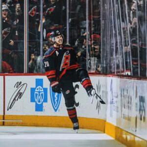 Sebastian Aho Carolina Hurricanes Autographed 16" x 20" Black Jersey Celebration Photograph
