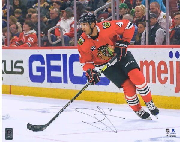 Seth Jones Chicago Blackhawks Autographed 16" x 20" Red Jersey Skating Photograph