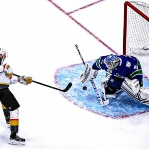 Thatcher Demko Vancouver Canucks Unsigned White Jersey In Net Photograph